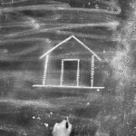 Felipe Peña contemporary art: A child’s hand, wearing a striped sleeve, draws a simple house with a door using white chalk on a dusty blackboard. The house consists of a square base and a peaked roof. The background is smudged and speckled with chalk dust. , exclusive contemporary art for New York collectors